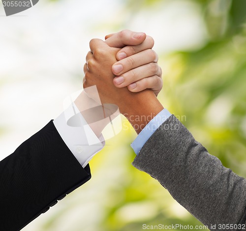 Image of hands of two people armwrestling