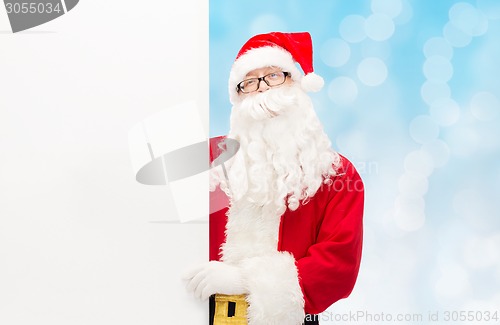 Image of man in costume of santa claus with billboard