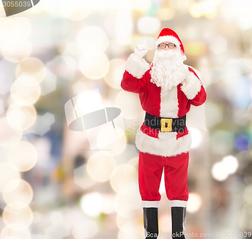 Image of man in costume of santa claus with bag