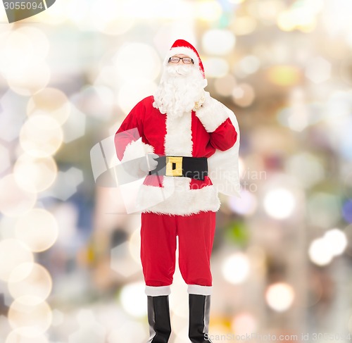 Image of man in costume of santa claus with bag