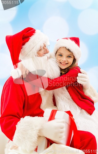 Image of smiling little girl with santa claus