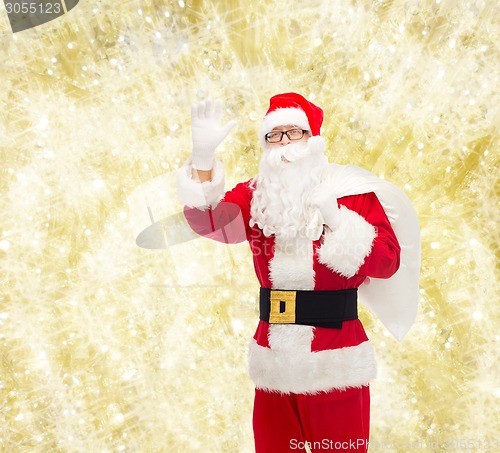 Image of man in costume of santa claus with bag