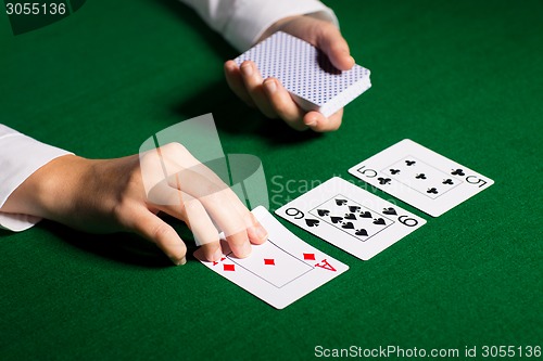 Image of holdem dealer with playing cards