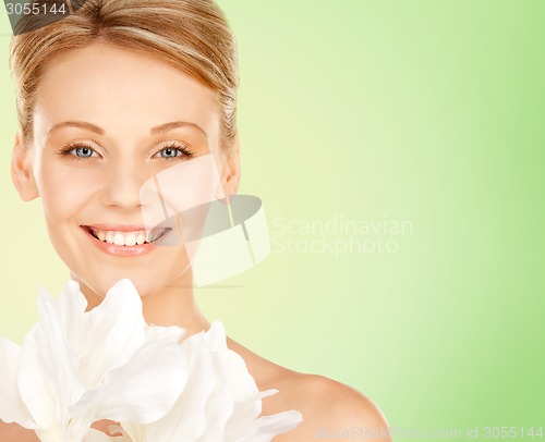 Image of beautiful young woman with bare shoulders