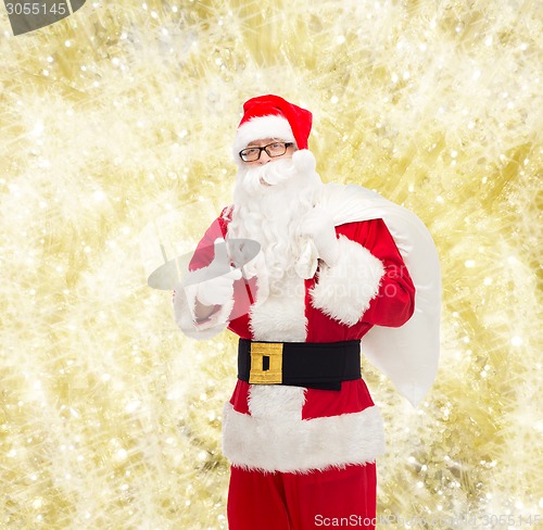 Image of man in costume of santa claus with bag