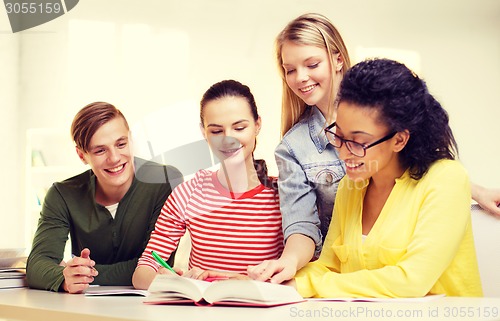 Image of students with textbooks and books at school