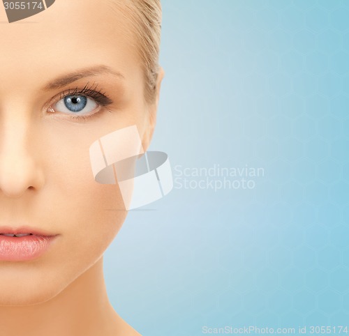 Image of beautiful young woman half face
