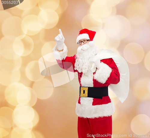 Image of man in costume of santa claus with bag