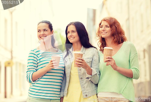 Image of smiling teenage girls with on street