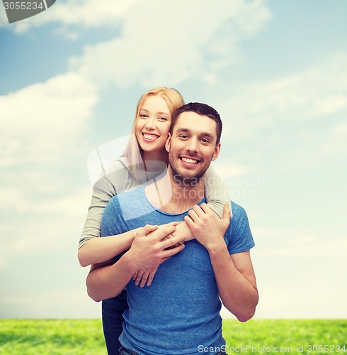 Image of smiling couple hugging
