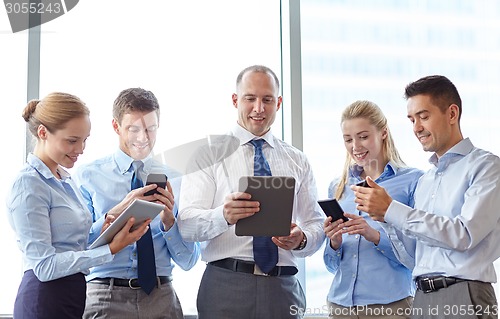 Image of business people with tablet pc and smartphones
