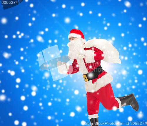 Image of man in costume of santa claus with bag