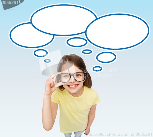 Image of smiling girl in eyeglasses with blank text bubbles