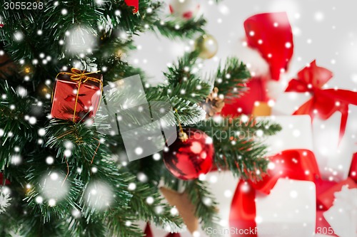 Image of close up of christmas tree and presents
