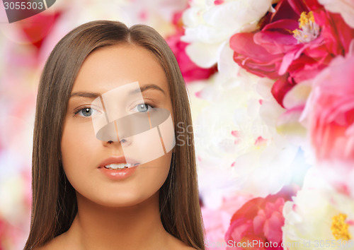 Image of beautiful young woman with bare shoulders