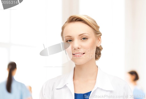 Image of smiling young female doctor in hospital