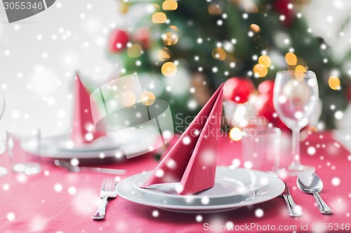 Image of room with christmas tree and decorated table