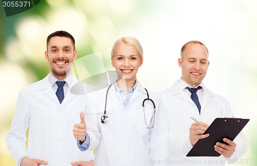 Image of group of doctors showing thumbs up over white