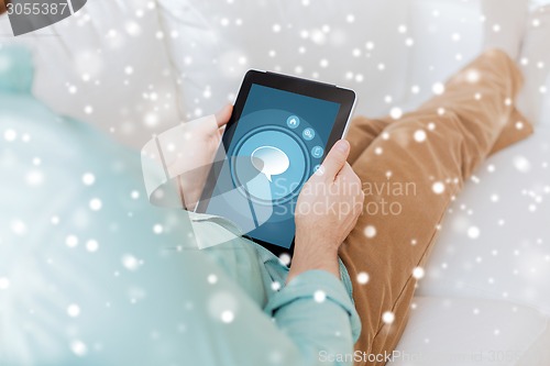 Image of close up of man with tablet pc computer at home