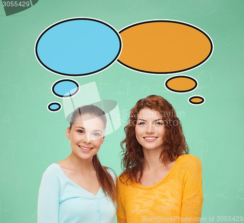 Image of smiling student girls with text bubbles