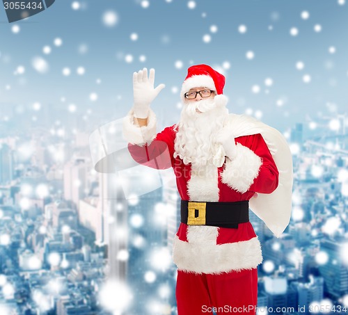 Image of man in costume of santa claus with bag