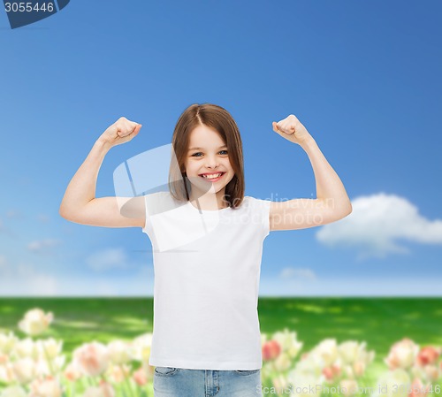 Image of smiling little girl in white blank t-shirt