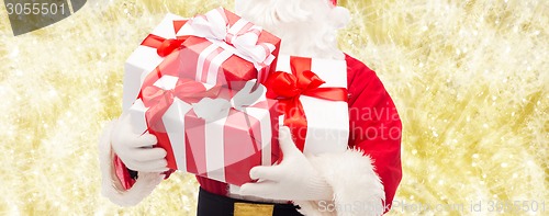 Image of close up of santa claus with gift box