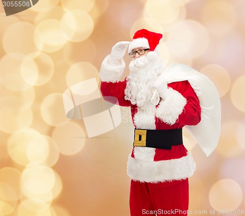 Image of man in costume of santa claus with bag