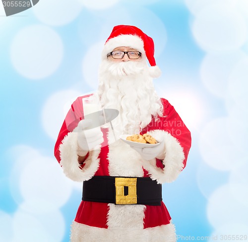 Image of santa claus with glass of milk and cookies