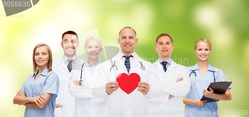 Image of group of smiling doctors with red heart shape