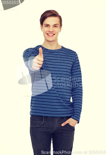 Image of smiling teenage boy showing thumbs up