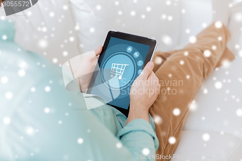 Image of close up of man with tablet pc computer at home