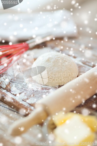 Image of close up of dough and utensils on cutting board