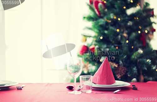 Image of room with christmas tree and decorated table