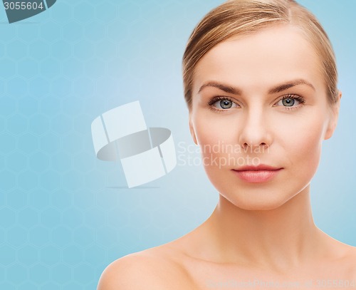 Image of beautiful young woman with bare shoulders