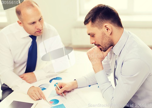 Image of two businessmen having discussion in office