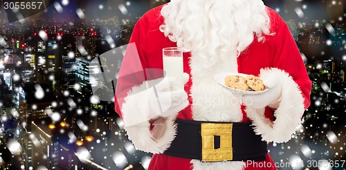 Image of santa claus with glass of milk and cookies