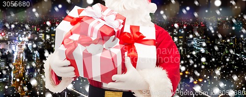 Image of close up of santa claus with gift box
