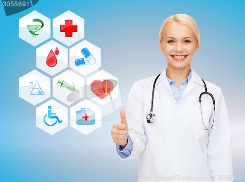 Image of smiling female doctor showing thumbs up