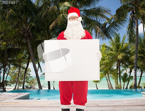 Image of man in costume of santa claus with billboard