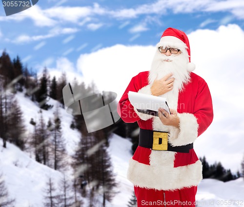 Image of man in costume of santa claus with notepad