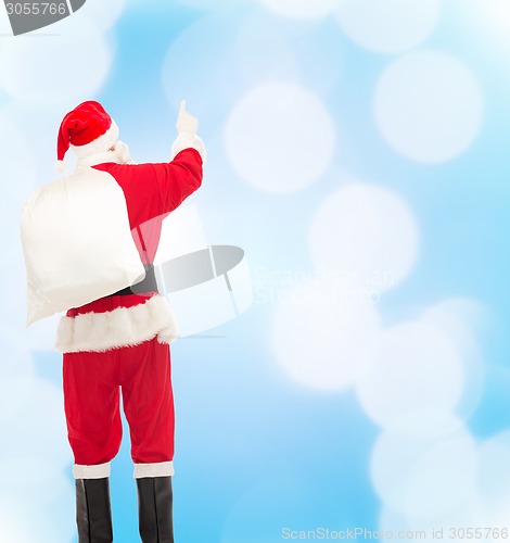 Image of man in costume of santa claus with bag