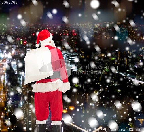 Image of man in costume of santa claus with bag
