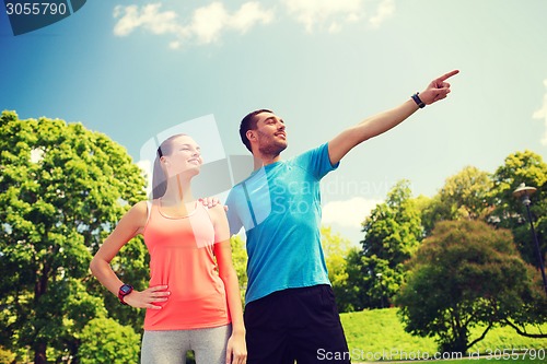 Image of two smiling people outdoors