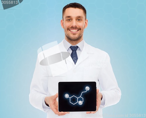 Image of smiling male doctor showing tablet pc screen