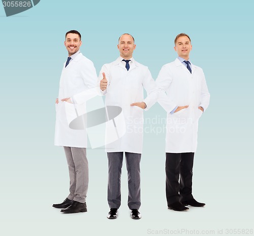 Image of smiling male doctors in white coats