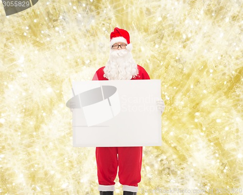 Image of man in costume of santa claus with billboard