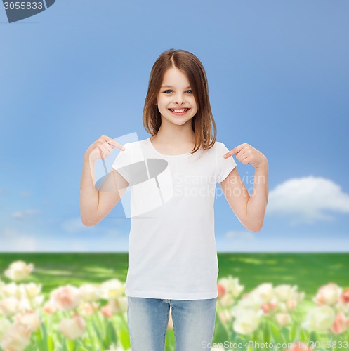Image of smiling little girl in white blank t-shirt