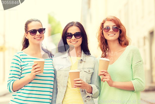 Image of smiling teenage girls with on street