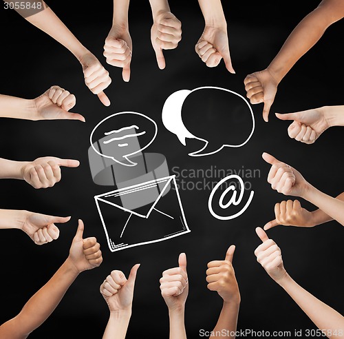 Image of hands showing thumbs up  with over e-mail symbols